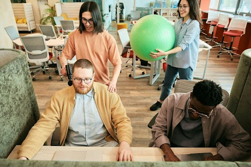 Employees working in an inclusive office environment that supports comfort and wellbeing