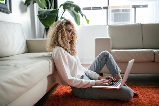 Person working on a laptop at home, reflecting a modern lifestyle and daily routines